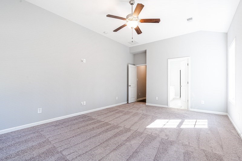 32 Maple Lakes Drive Cataula, GA 31804 - Photo 11 of 27 an empty room with wooden floor and windows