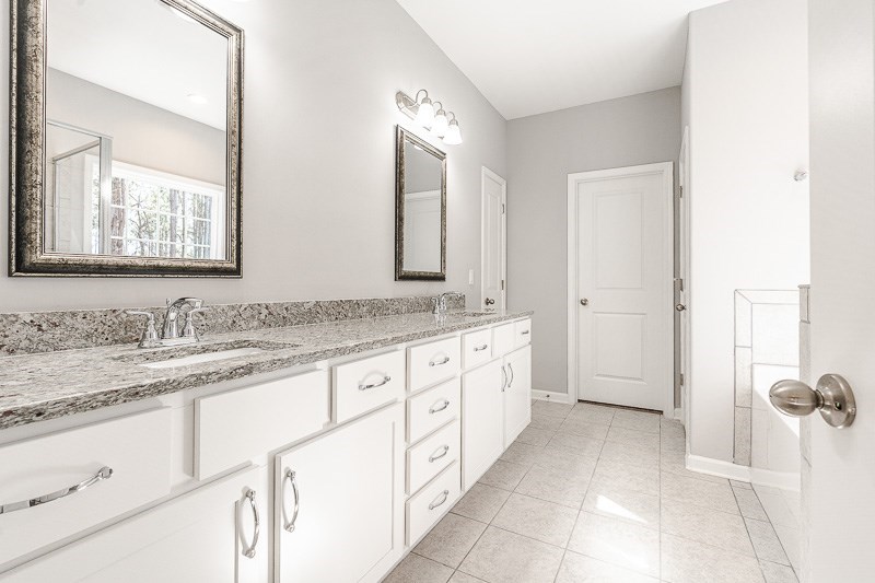 32 Maple Lakes Drive Cataula, GA 31804 - Photo 13 of 27 a bathroom with a granite countertop sink mirror and