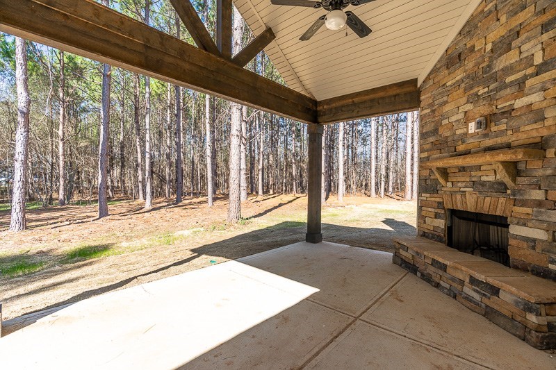 32 Maple Lakes Drive Cataula, GA 31804 - Photo 25 of 27 a view of an empty room with wooden floor and a fireplace