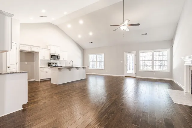 a view of kitchen with cabinets and wooden floor