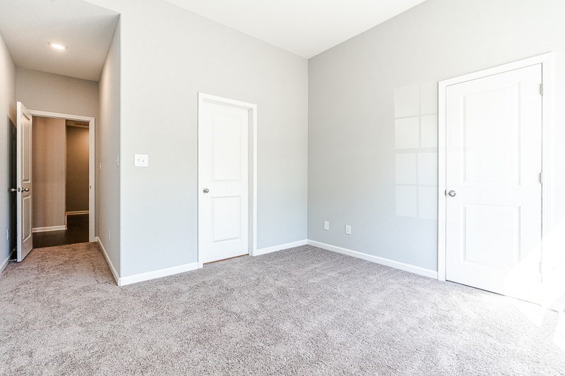 32 Maple Lakes Drive Cataula, GA 31804 - Photo 10 of 27 an empty room with closet and a bathroom