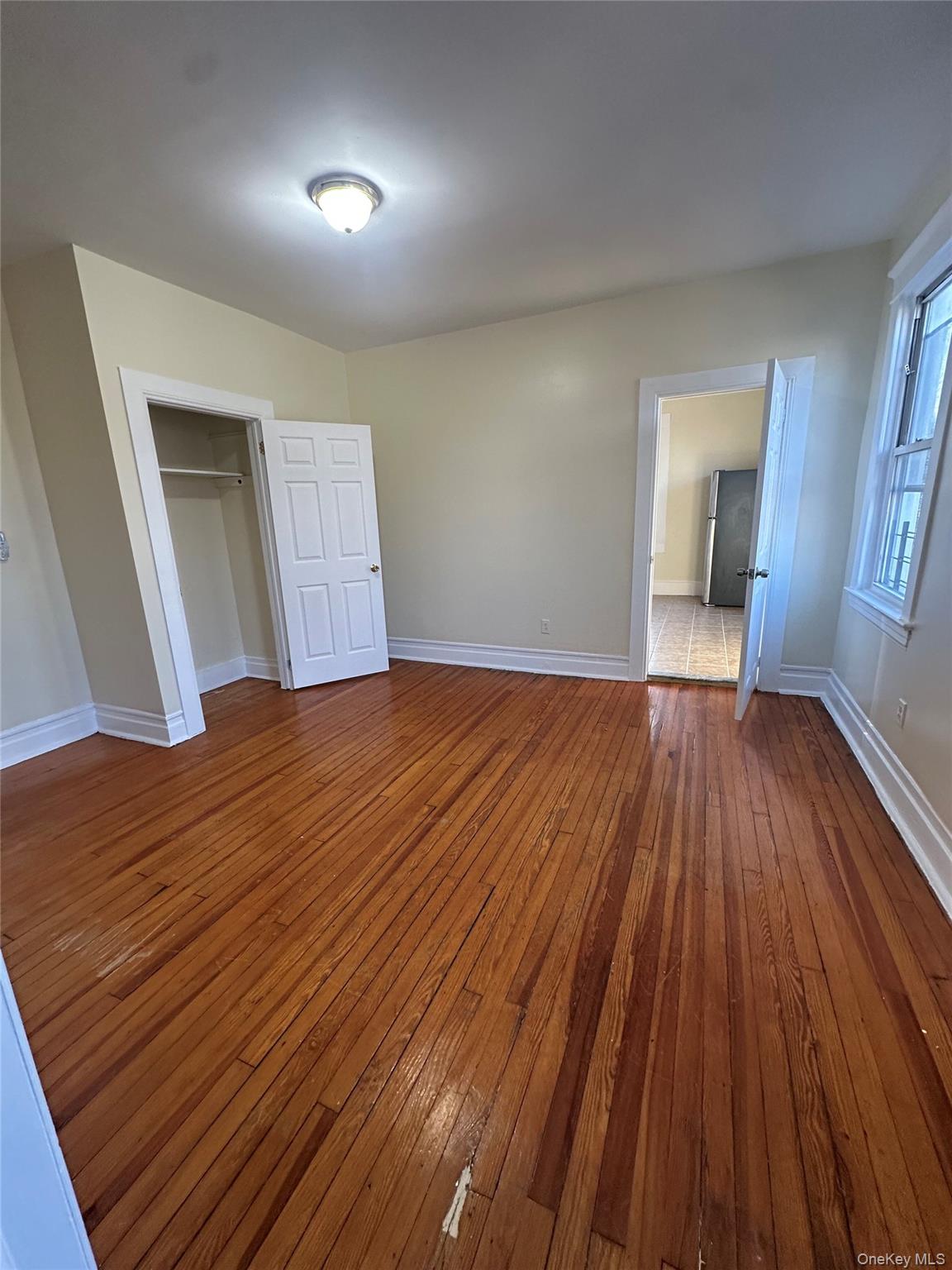 22 Clove Road New Rochelle, NY 10801 - Photo 5 of 11 a view of a room with wooden floor and a window
