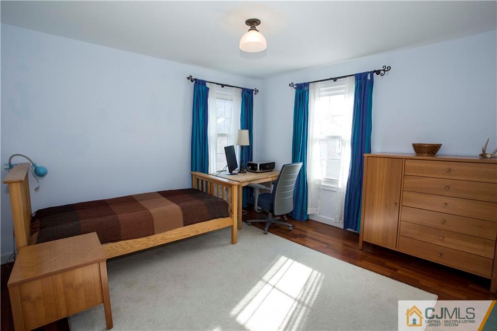 3806 Springbrook Drive Edison, NJ 08820 - Photo 16 of 22 a bedroom with a bed and a window