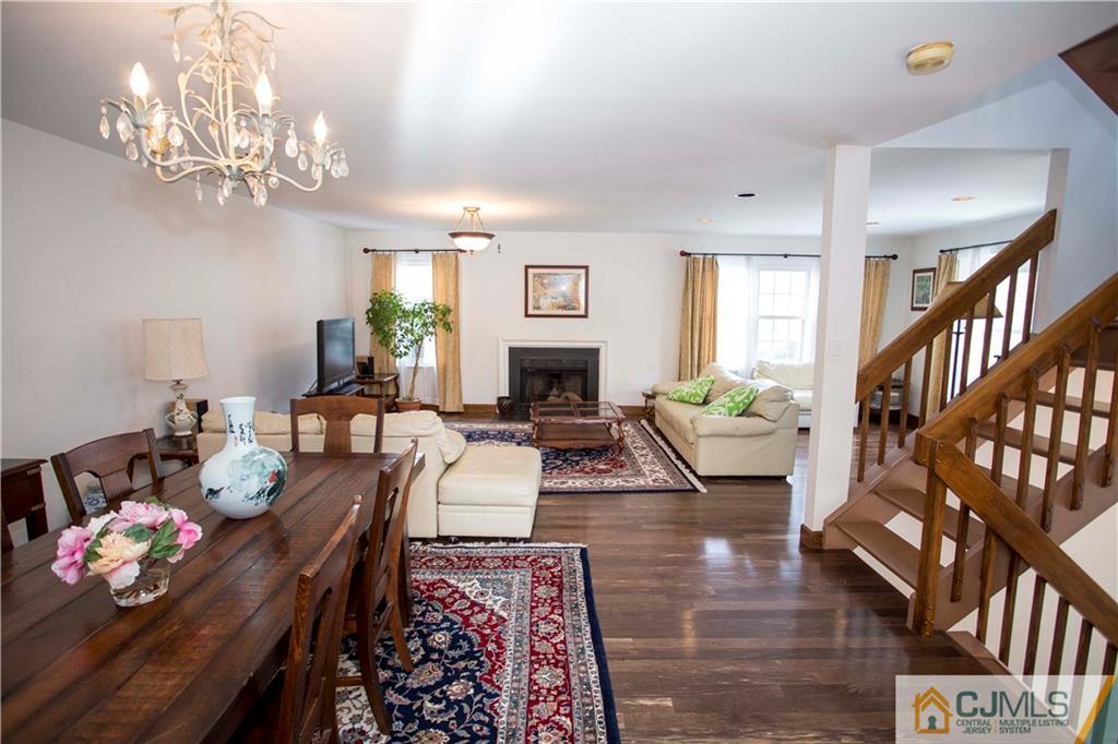 3806 Springbrook Drive Edison, NJ 08820 - Photo 3 of 22 a living room with fireplace furniture and a chandelier