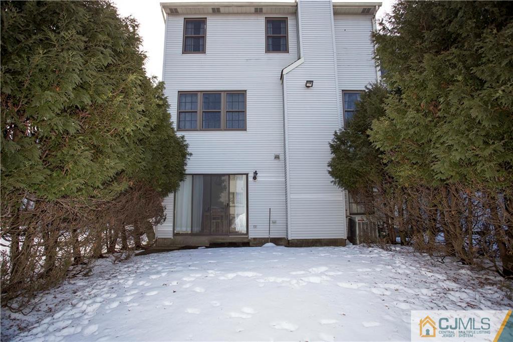 3806 Springbrook Drive Edison, NJ 08820 - Photo 21 of 22 a view of a house with a yard and garage