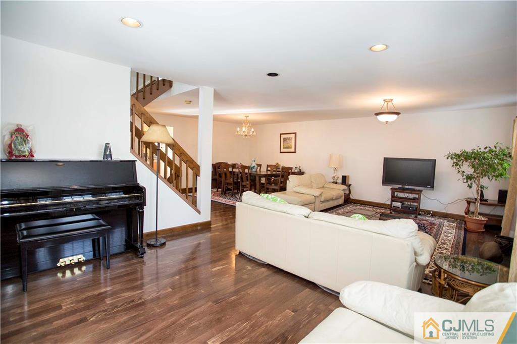 3806 Springbrook Drive Edison, NJ 08820 - Photo 4 of 22 a living room with furniture and a flat screen tv