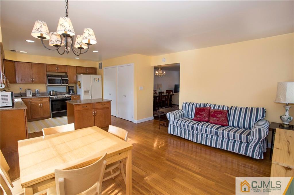 3806 Springbrook Drive Edison, NJ 08820 - Photo 5 of 22 a living room with furniture and a chandelier