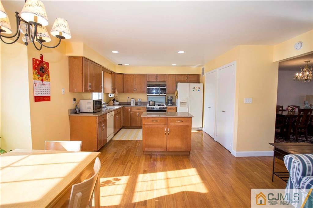 3806 Springbrook Drive Edison, NJ 08820 - Photo 7 of 22 a large kitchen with cabinets