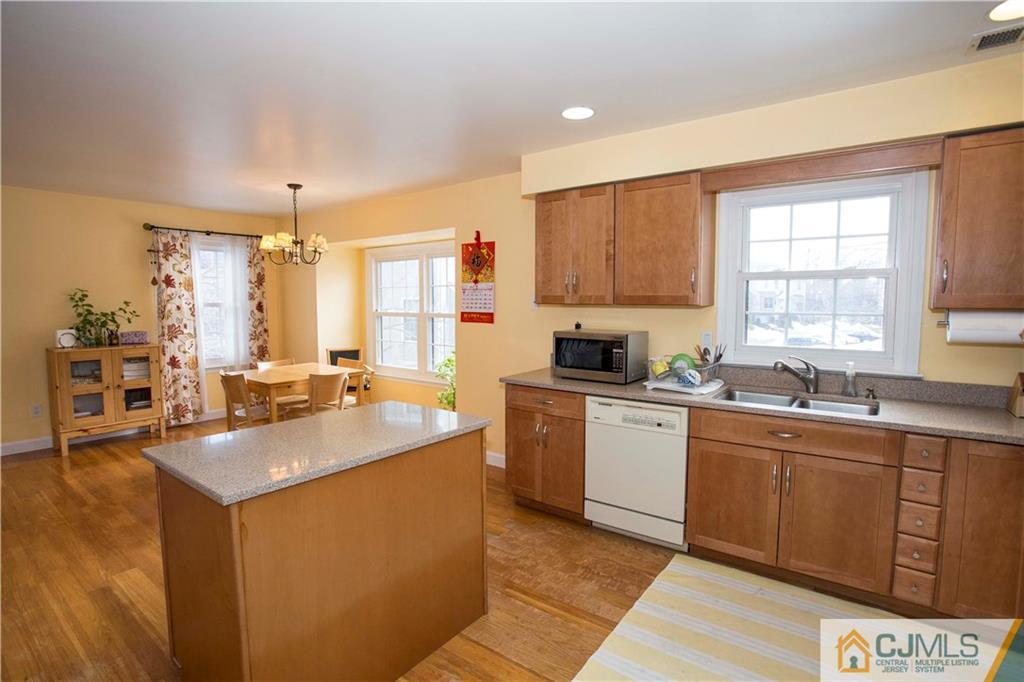 3806 Springbrook Drive Edison, NJ 08820 - Photo 8 of 22 a kitchen with a sink stove and cabinets