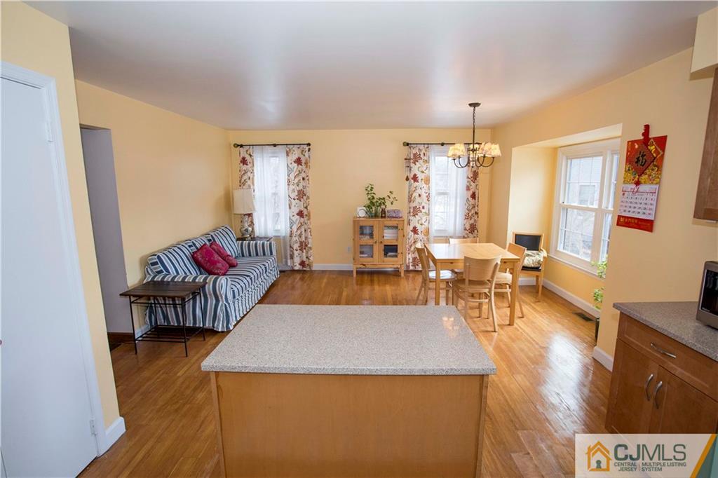 3806 Springbrook Drive Edison, NJ 08820 - Photo 9 of 22 a living room with furniture and a chandelier