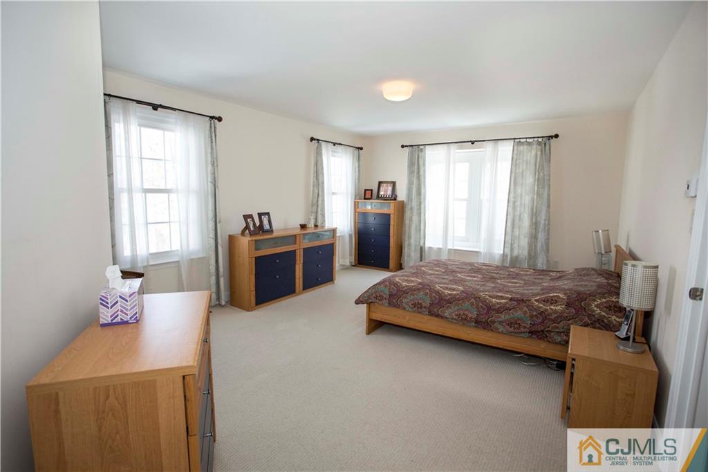 3806 Springbrook Drive Edison, NJ 08820 - Photo 10 of 22 a bedroom with a bed and window