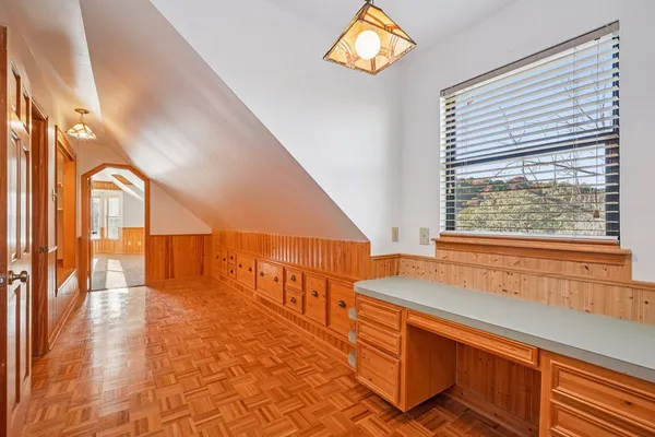 a view of an entryway with wooden floor