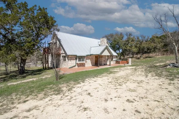 a view of house with outdoor space