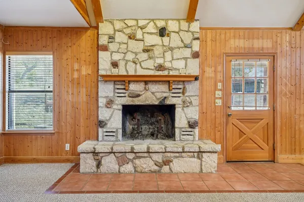 a living room with a couch and a fireplace