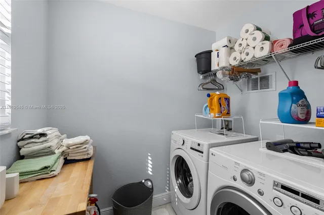 a utility room with dryer and washer