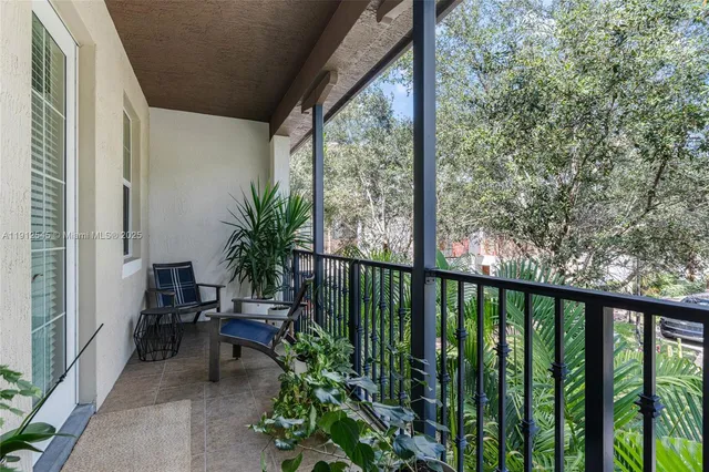 a view of balcony with furniture