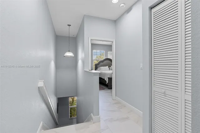 a view of a hallway with a room