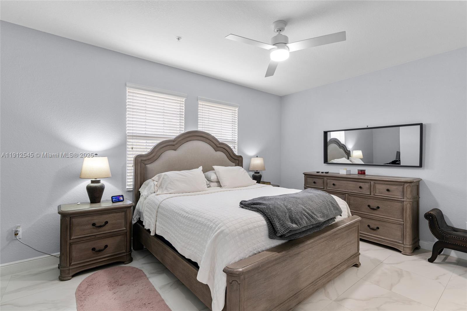 2565 Southwest 119th Terrace Miramar, FL 33025 - Photo 20 of 37 a bedroom with a bed and wooden floor