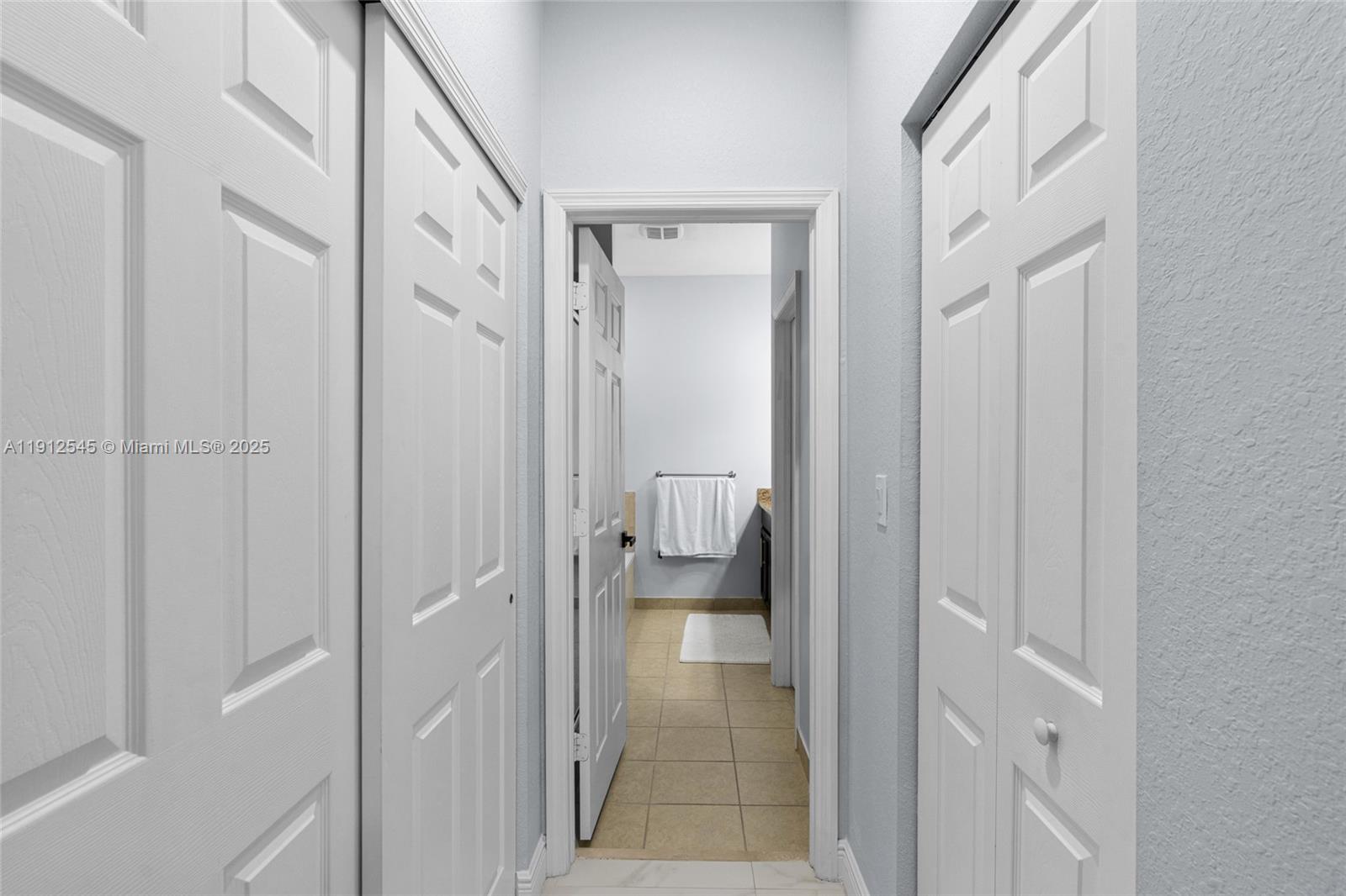 2565 Southwest 119th Terrace Miramar, FL 33025 - Photo 22 of 37 a bathroom with a glass shower door