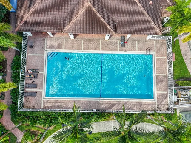 a front view of house with a garden