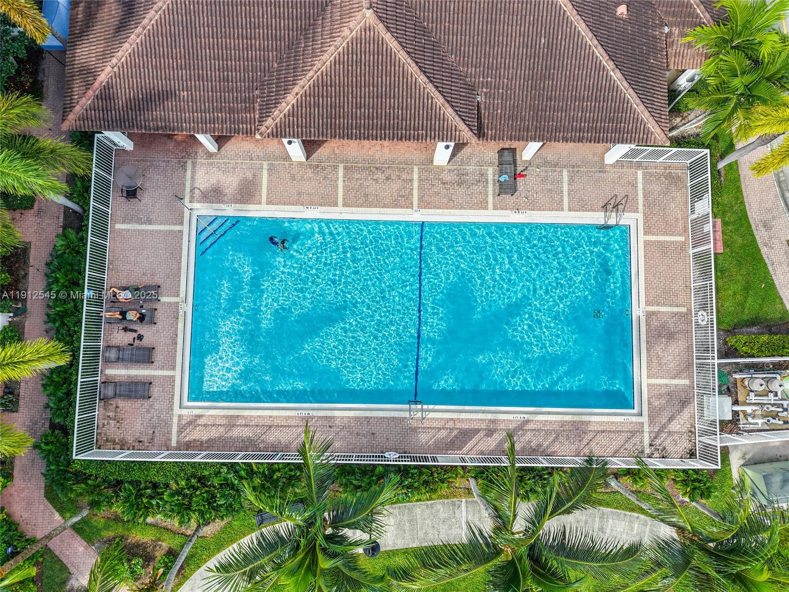 2565 Southwest 119th Terrace Miramar, FL 33025 - Photo 35 of 37 a front view of house with a garden