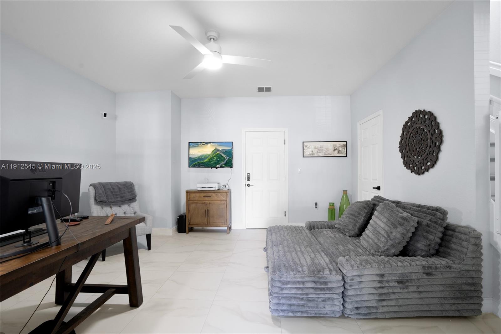 2565 Southwest 119th Terrace Miramar, FL 33025 - Photo 5 of 37 a living room with furniture