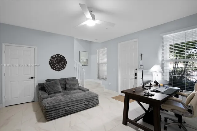 a living room with furniture and a table