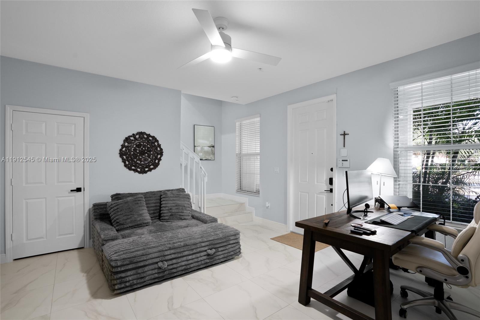 2565 Southwest 119th Terrace Miramar, FL 33025 - Photo 6 of 37 a living room with furniture and a table