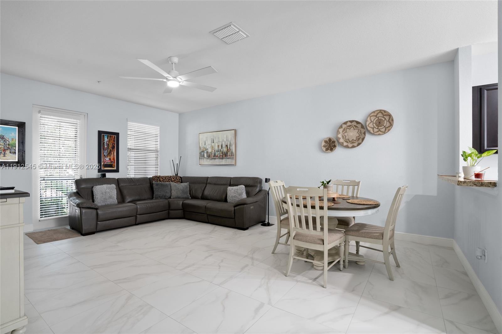 2565 Southwest 119th Terrace Miramar, FL 33025 - Photo 8 of 37 a living room with furniture wooden floor and window