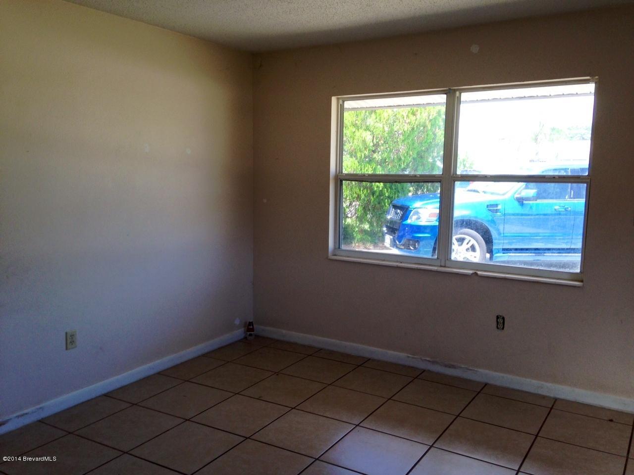 2767 North Breeze Road Melbourne, FL 32935 - Photo 8 of 17 a view of a room that has a window in it