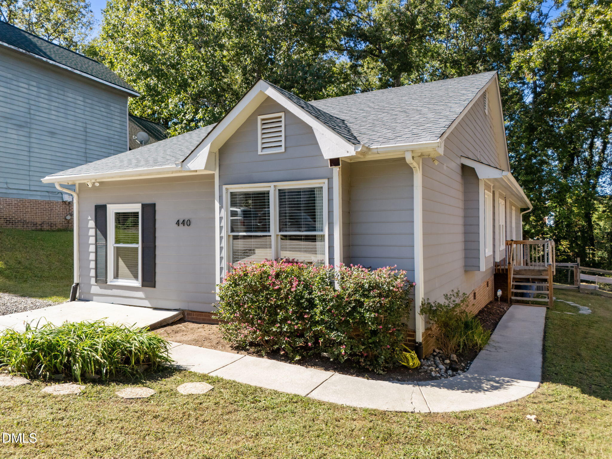 440 Dickens Drive Raleigh, NC 27610 - Photo 15 of 18 a front view of a house with garden