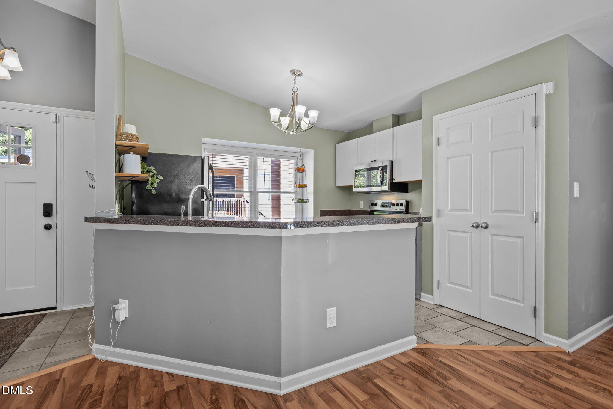 440 Dickens Drive Raleigh, NC 27610 - Photo 3 of 18 a kitchen with stainless steel appliances granite countertop a refrigerator and a stove top oven