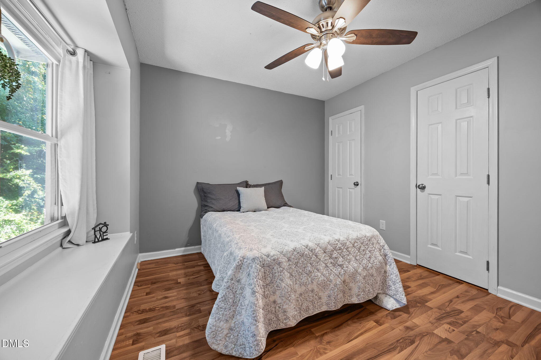 440 Dickens Drive Raleigh, NC 27610 - Photo 8 of 18 a bedroom with a bed and a ceiling fan