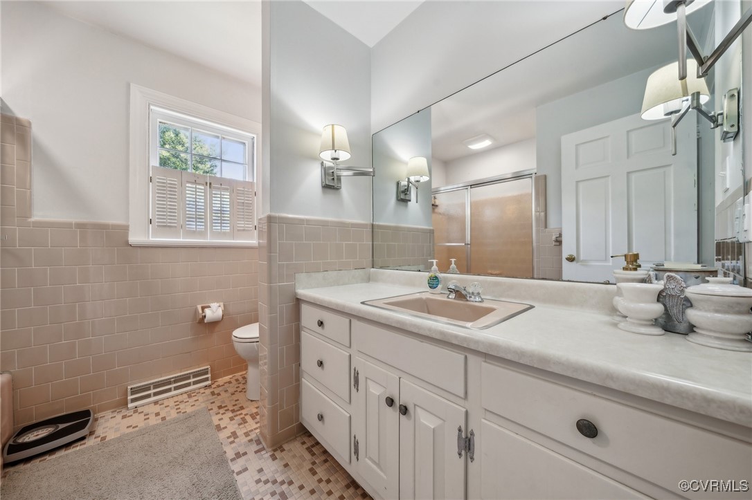 8203 Overbury Road Richmond, VA 23227 - Photo 24 of 50 Full bath featuring a stall shower, tile walls, wa