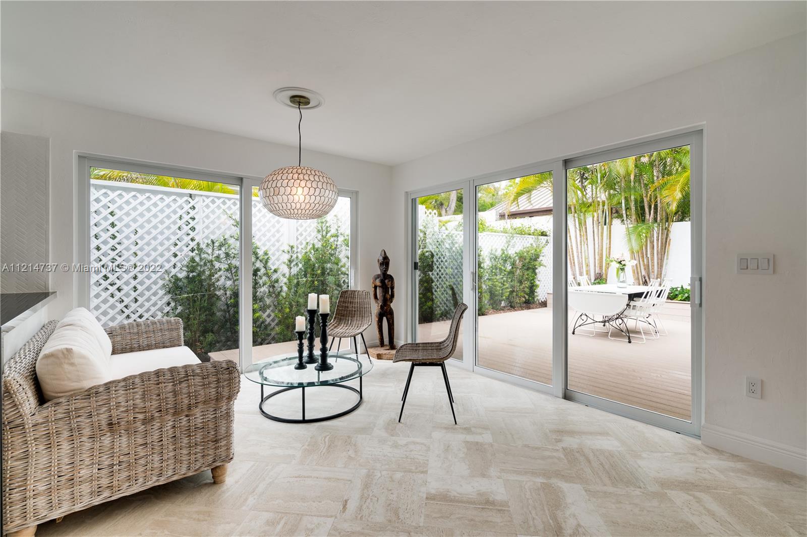 3731 Battersea Road Miami, FL 33133 - Photo 11 of 44 a living room with furniture and a large window