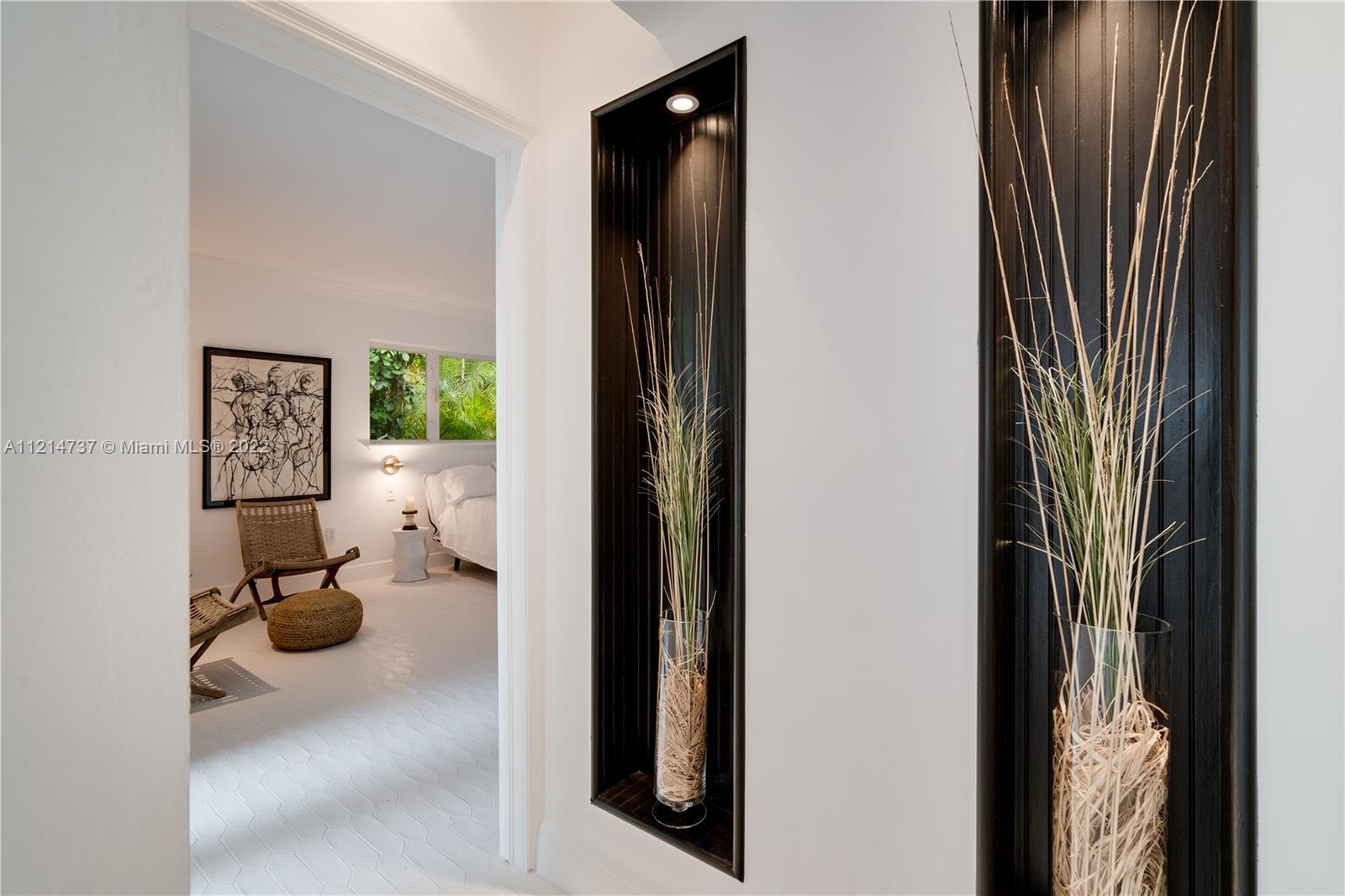 3731 Battersea Road Miami, FL 33133 - Photo 16 of 44 view of living room with furniture and floor to ceiling window