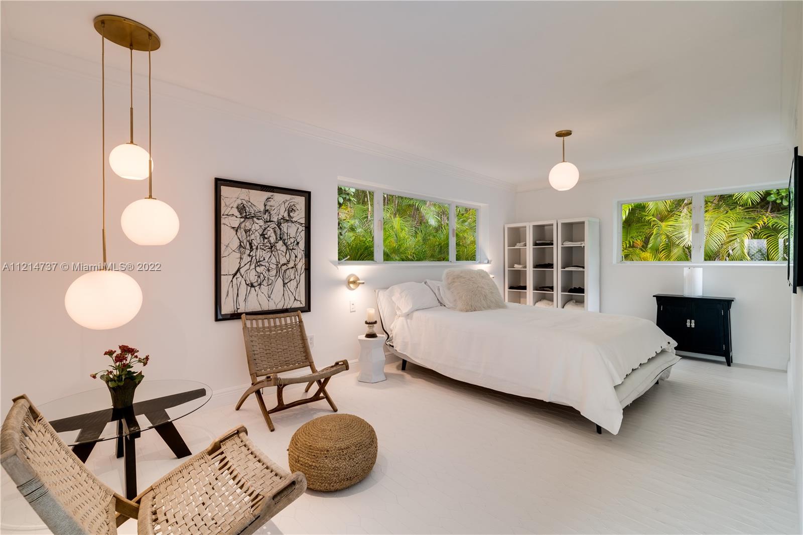 3731 Battersea Road Miami, FL 33133 - Photo 17 of 44 a living room with furniture and a fireplace