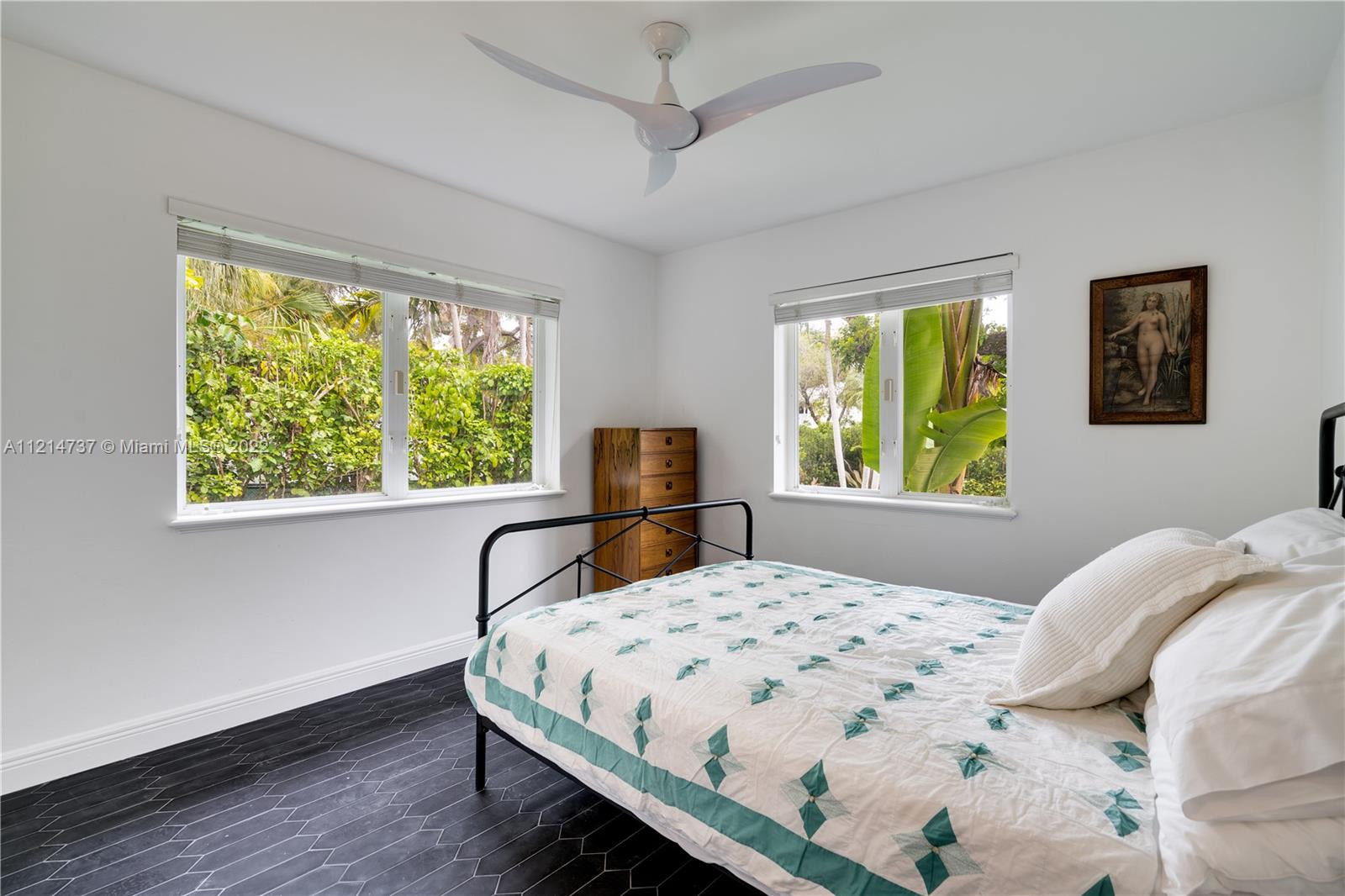 3731 Battersea Road Miami, FL 33133 - Photo 21 of 44 a bedroom with a bed and a large window