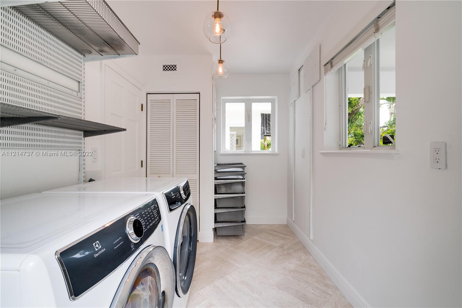 3731 Battersea Road Miami, FL 33133 - Photo 23 of 44 a utility room with dryer and washer