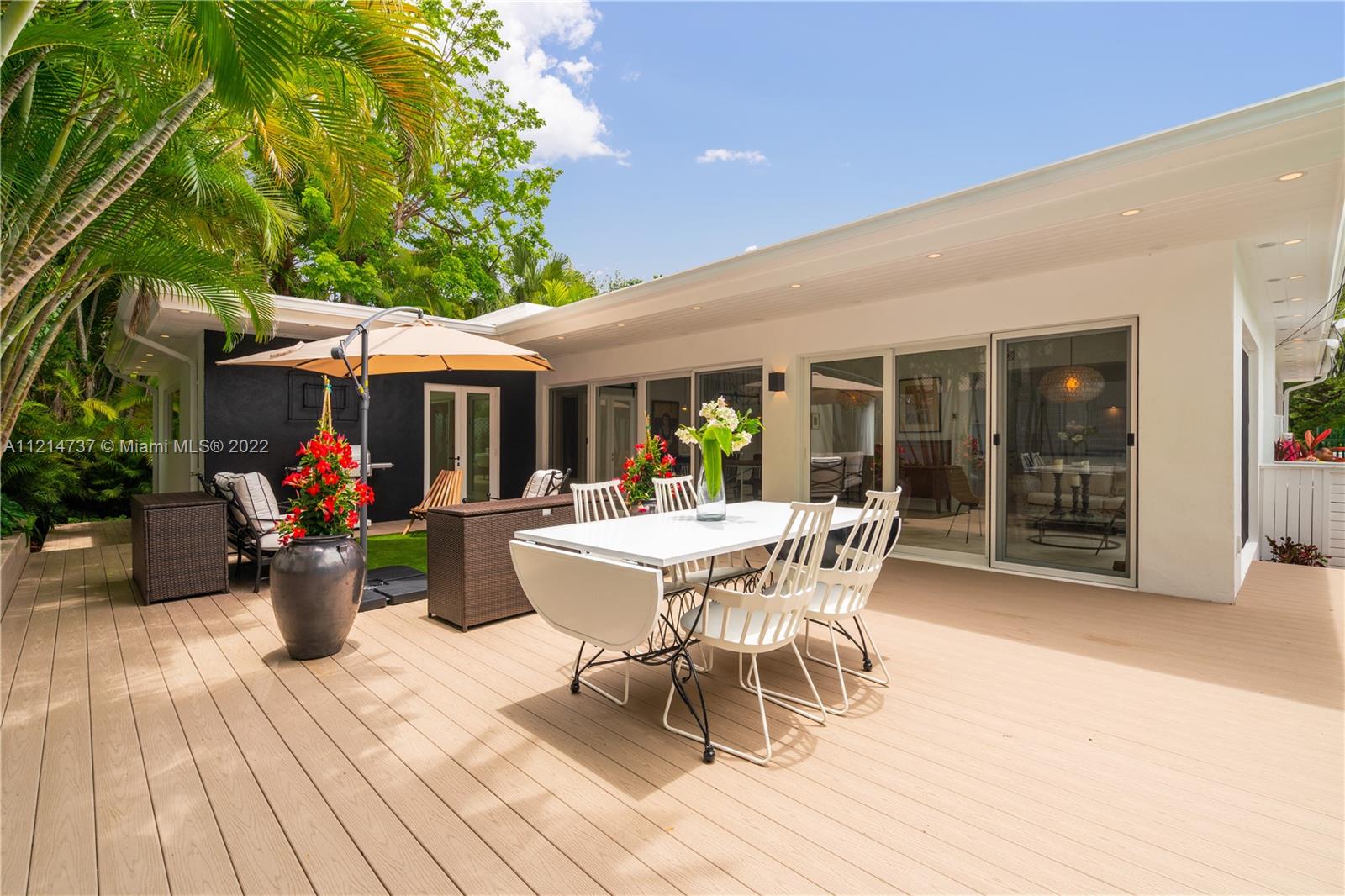 3731 Battersea Road Miami, FL 33133 - Photo 28 of 44 a dining room with furniture and garden view