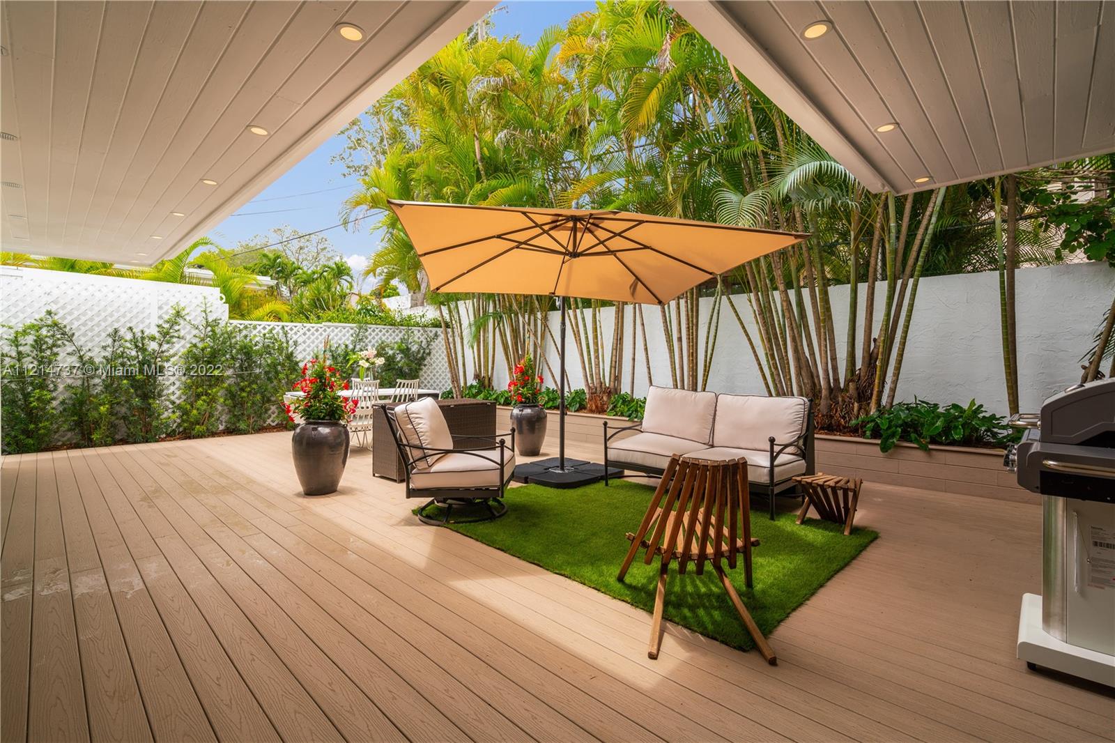 3731 Battersea Road Miami, FL 33133 - Photo 33 of 44 a view of outdoor space yard deck patio and outdoor kitchen