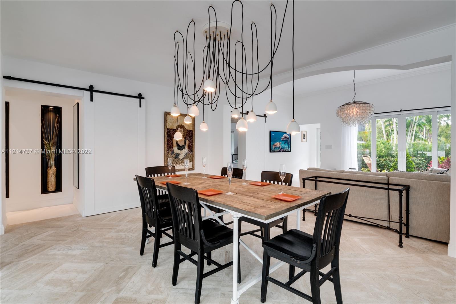 3731 Battersea Road Miami, FL 33133 - Photo 43 of 44 a dining room with furniture and window
