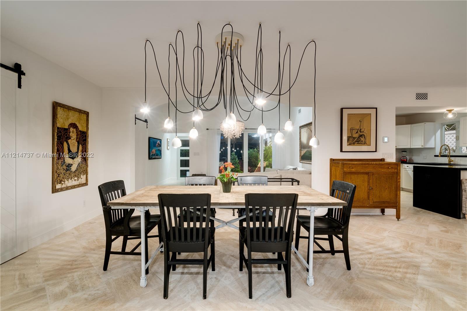 3731 Battersea Road Miami, FL 33133 - Photo 8 of 44 a view of a dining room with furniture