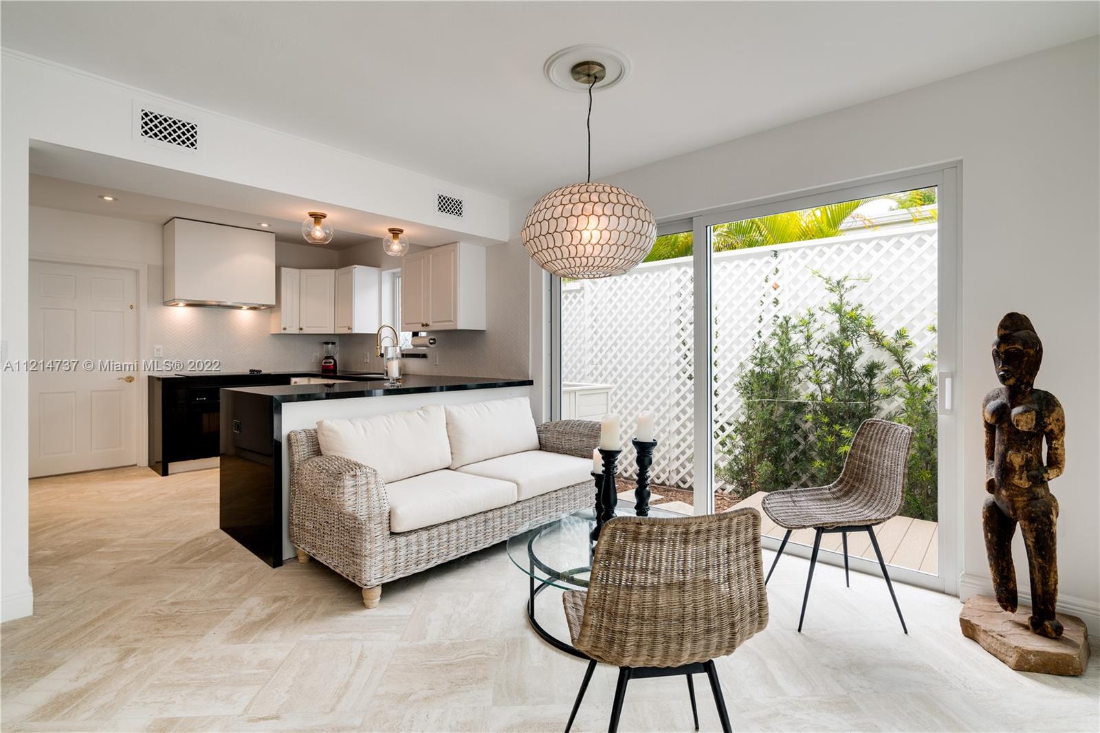 3731 Battersea Road Miami, FL 33133 - Photo 10 of 44 a living room with furniture and a large window