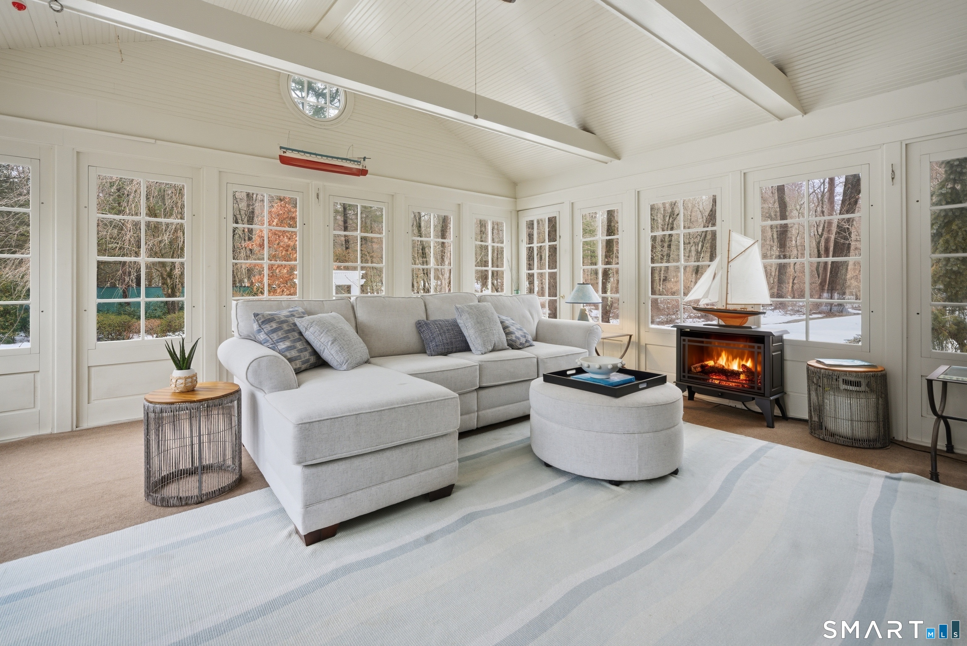 677 Eleven O'Clock Road Fairfield, CT 06824 - Photo 16 of 36 a living room with furniture and a fireplace