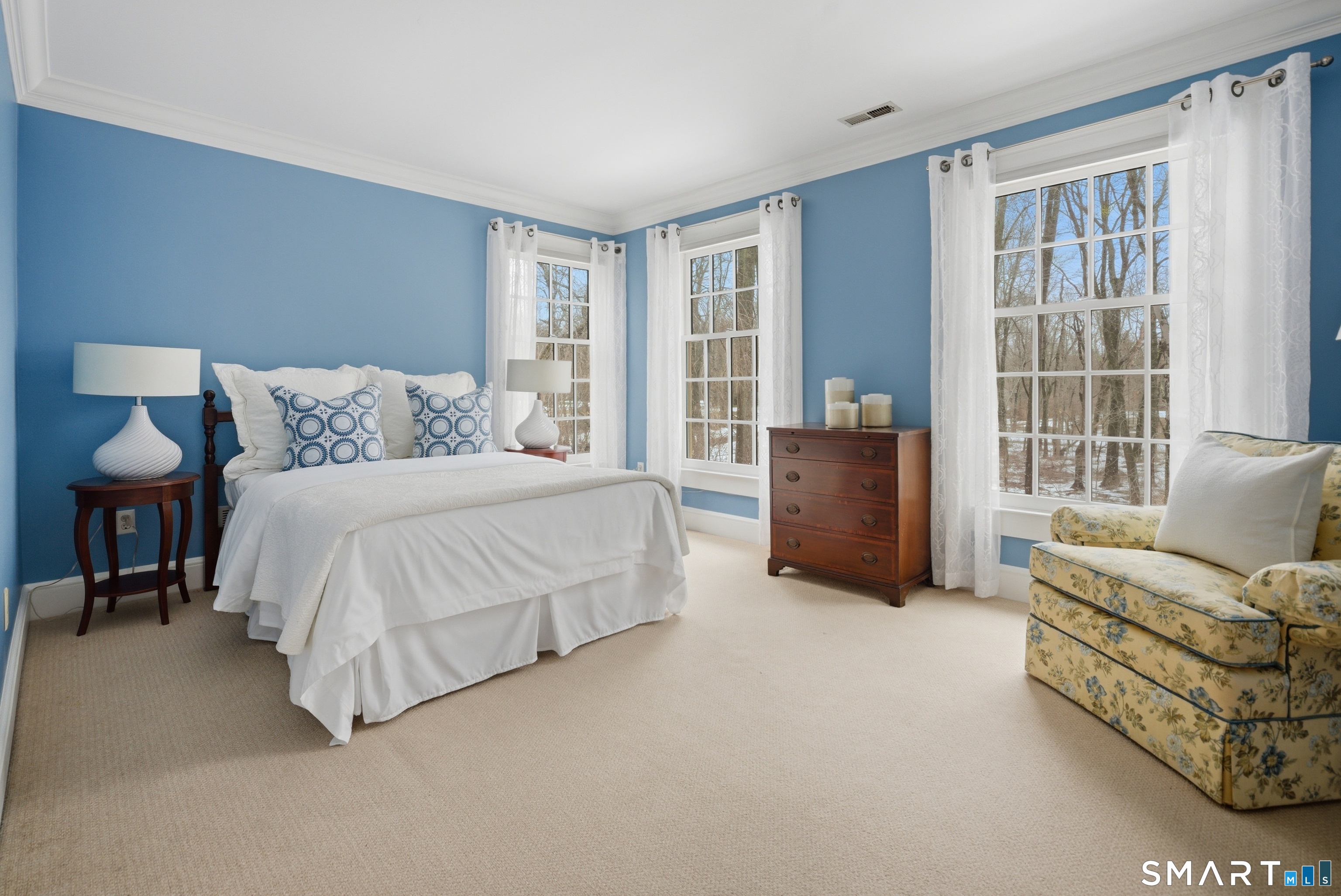 677 Eleven O'Clock Road Fairfield, CT 06824 - Photo 24 of 36 a spacious bedroom with a bed and glass window