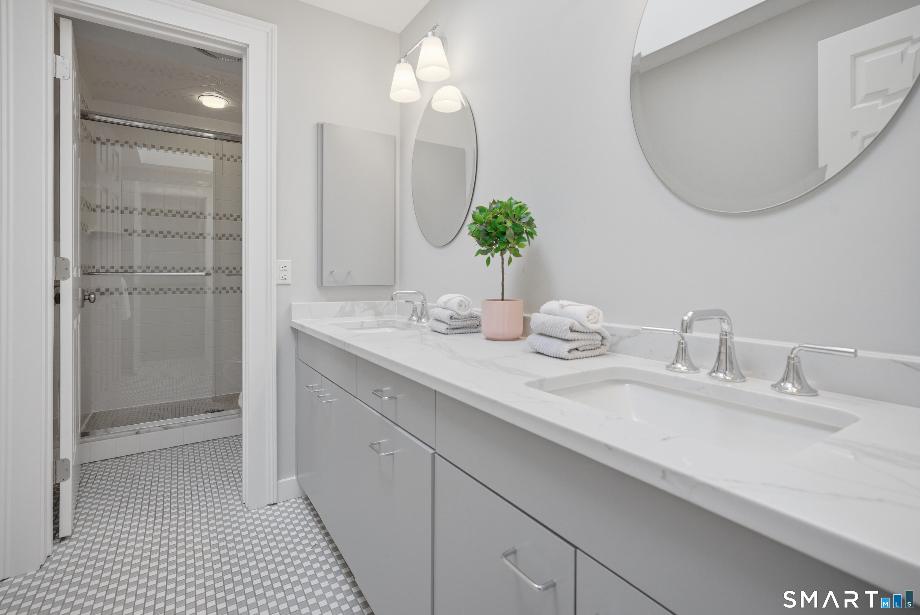 677 Eleven O'Clock Road Fairfield, CT 06824 - Photo 26 of 36 a bathroom with a double vanity sink and a mirror