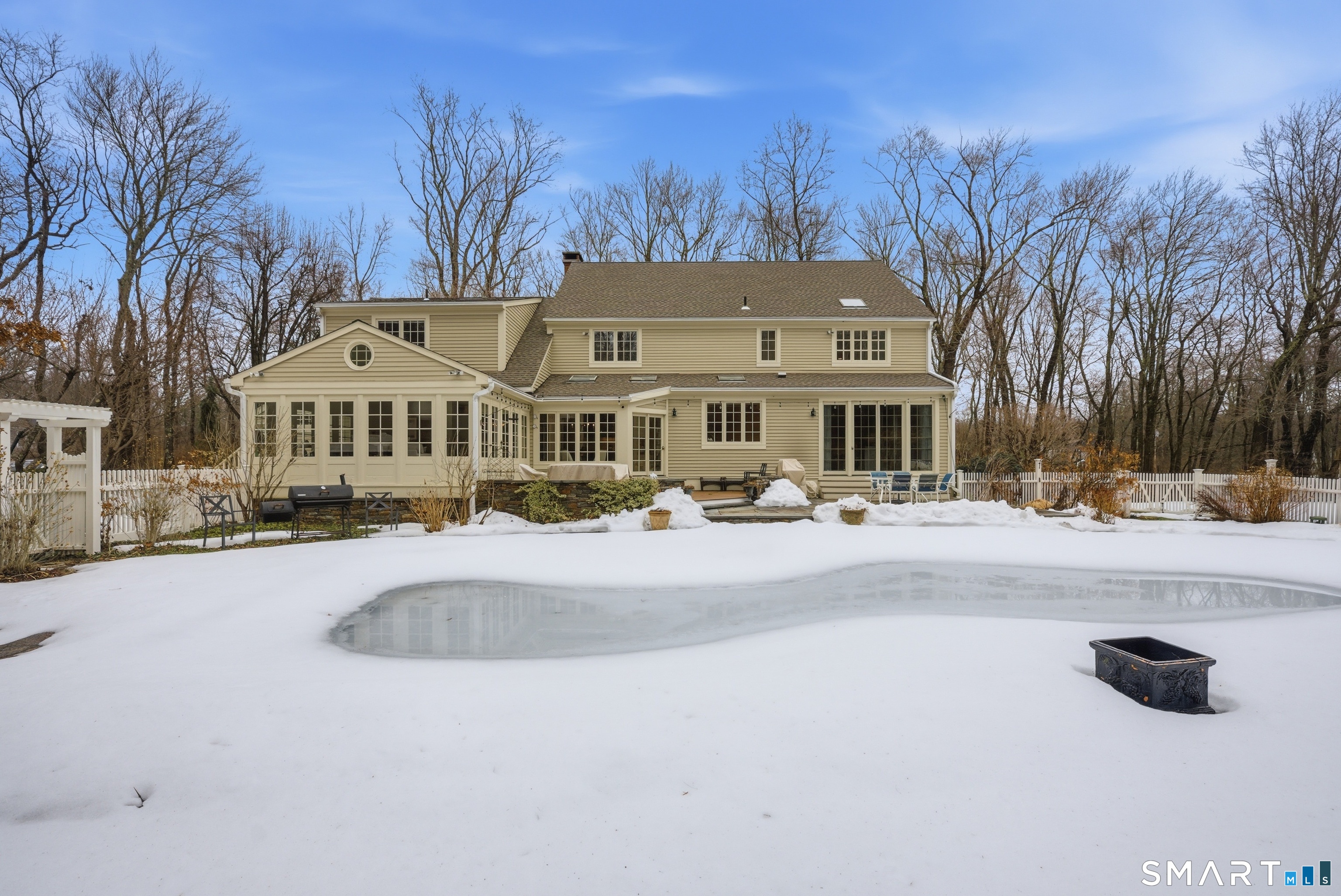 677 Eleven O'Clock Road Fairfield, CT 06824 - Photo 28 of 36 a front view of residential houses with yard and trees