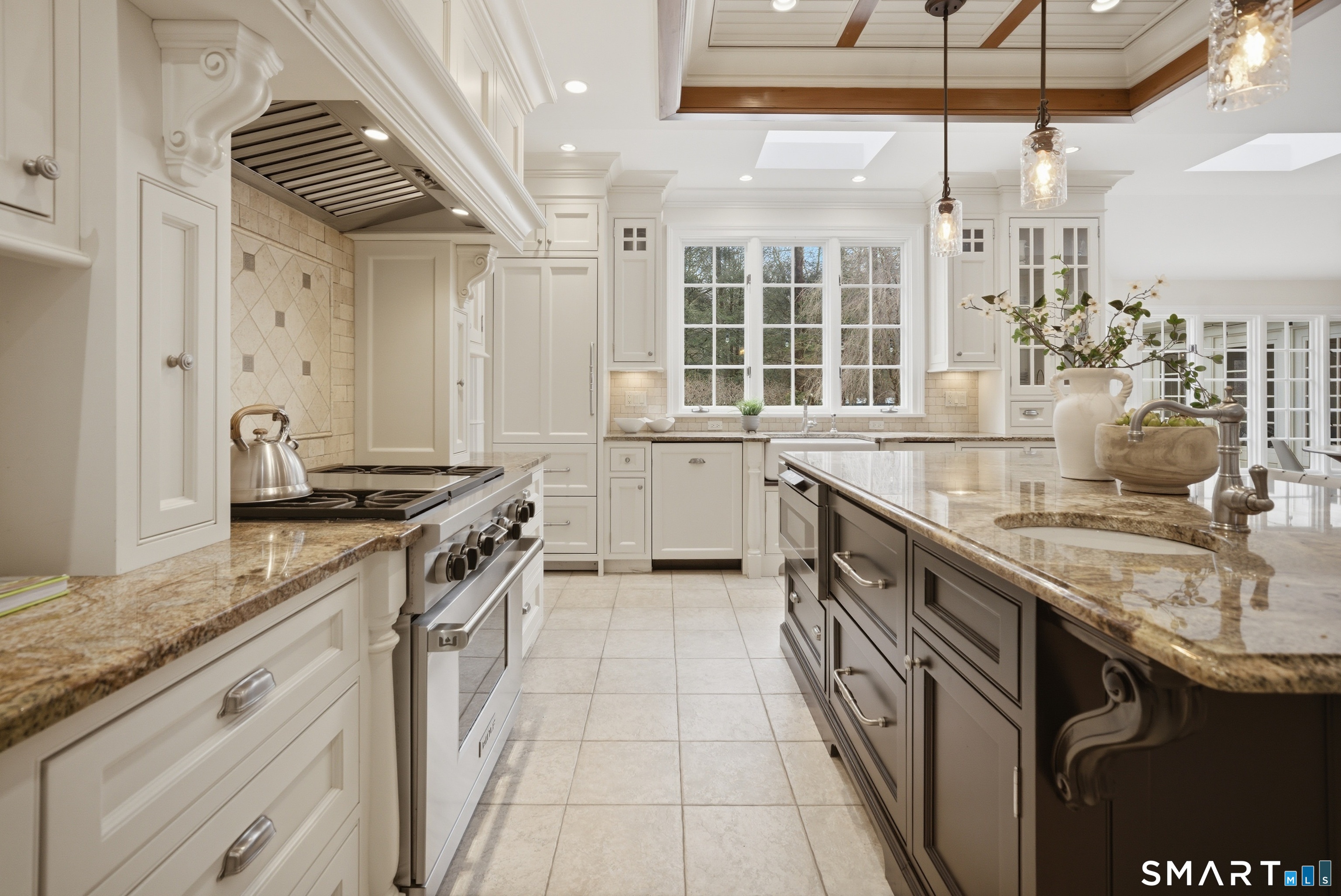 677 Eleven O'Clock Road Fairfield, CT 06824 - Photo 10 of 36 a kitchen with stainless steel appliances granite countertop a sink and stove