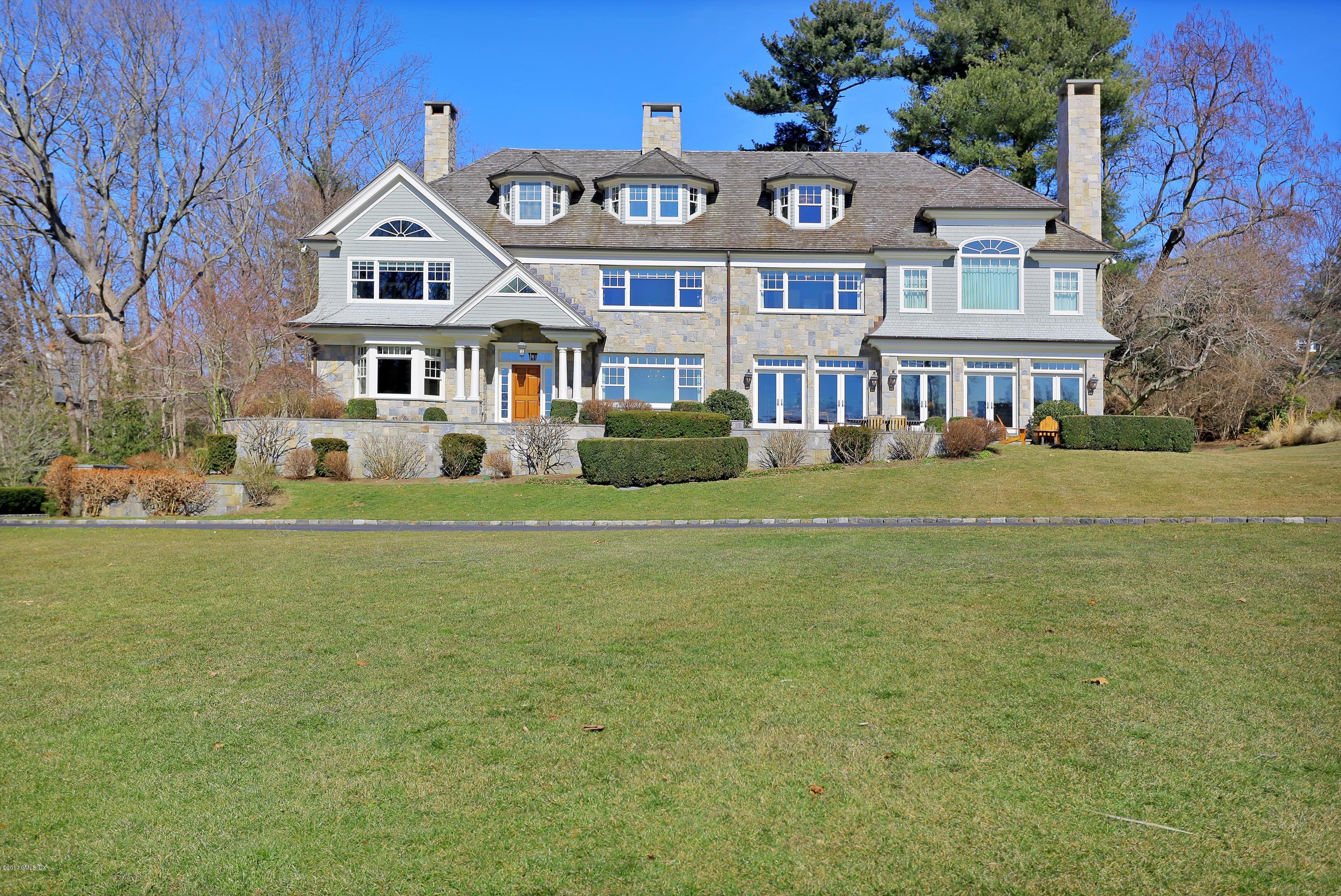 41 Leeward Lane Riverside, CT 06878 - Photo 1 of 27 a front view of a house with a garden